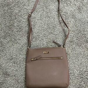 Kate Spade light purple-gray purse with front pocket.